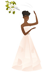 Image showing African bride tossing a bouquet of flowers.