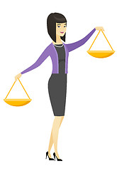 Image showing Asian business woman holding balance scale.