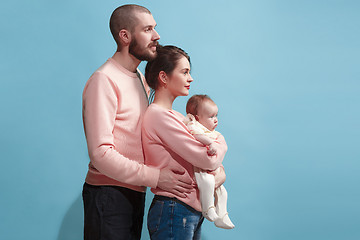 Image showing Happy family on the blue studio background