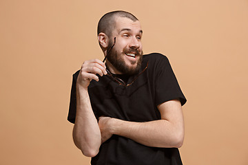 Image showing The happy business man smiling against pastel background.