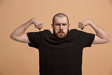 Image showing Strong businessman concept. Business man showing muscular hands