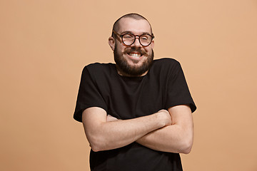 Image showing The happy business man smiling against pastel background.