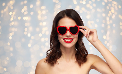 Image showing woman with red lipstick and heart shaped shades