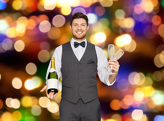 Image showing man with bottle of champagne and glasses at party