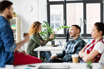 Image showing creative woman with smartphone at office