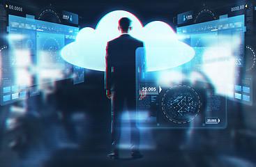 Image showing businessman looking at virtual cloud hologram