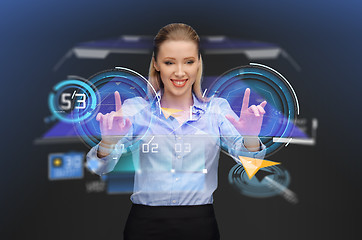 Image showing businesswoman with navigator on virtual screen