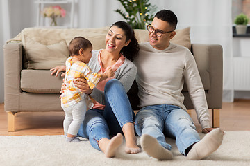 Image showing happy family with baby daughter at home