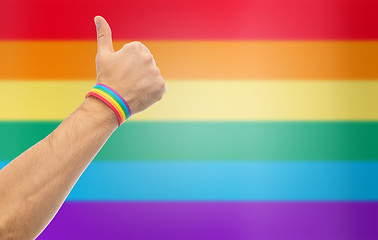 Image showing hand with gay pride rainbow wristband shows thumb