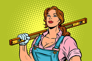 Image showing female construction worker with level