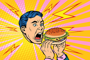 Image showing man eating Burger