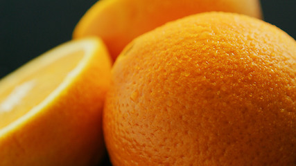 Image showing Closeup whole and cut orange 