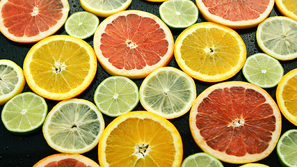Image showing Assortment of sliced citruses 
