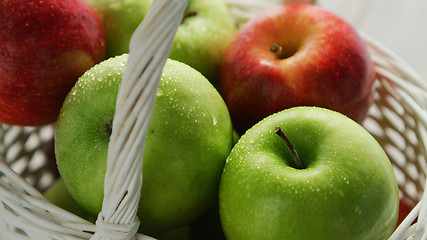 Image showing Mixed green and red apples in basket