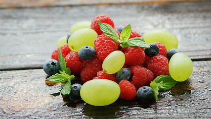 Image showing Berry mix on wet table 
