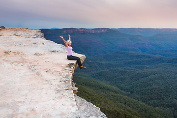 Image showing Sitting on the cliff edge feeling free