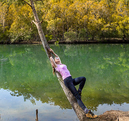 Image showing Female relaxes in a bushland Bliss