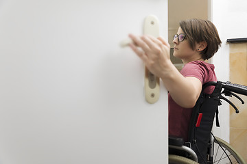 Image showing disabled woman at the open door with space for your content