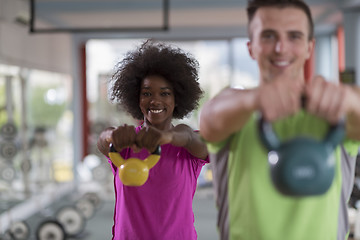 Image showing couple  workout with weights at  crossfit gym