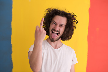 Image showing young man with funny hair over color background