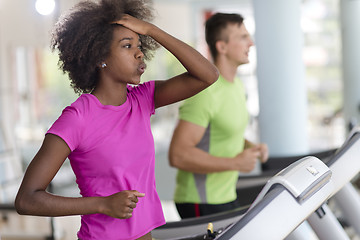 Image showing people exercisinng a cardio on treadmill