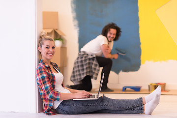 Image showing Happy couple doing home renovations