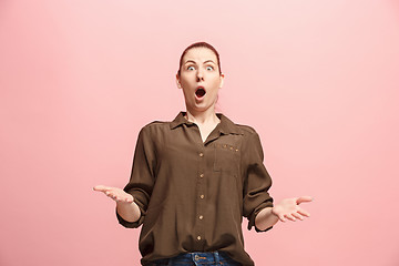 Image showing Beautiful woman looking suprised isolated on pink