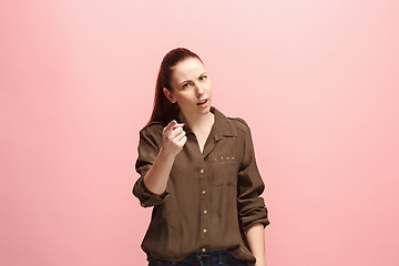 Image showing The overbearing business woman point you and want you, half length closeup portrait on pink background.