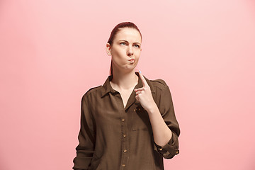 Image showing Young serious thoughtful business woman. Doubt concept.