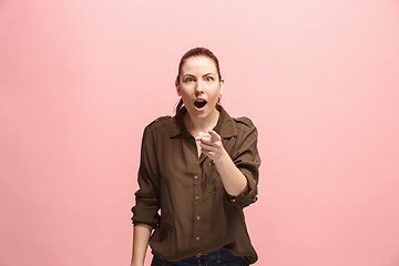 Image showing The happy business woman point you and want you, half length closeup portrait on pink background.