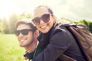 Image showing happy couple with backpacks having fun outdoors