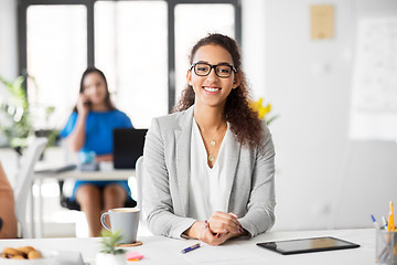 Image showing happy smiling african american woman at office