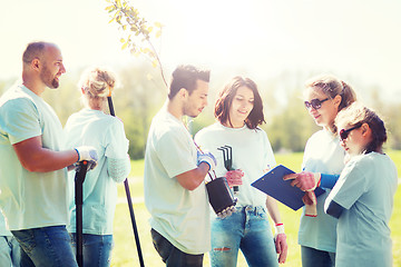 Image showing group of volunteers planting trees in park