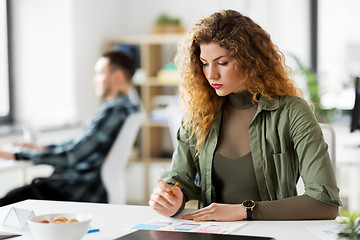 Image showing creative woman working on user interface at office