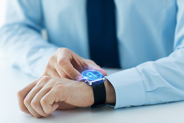 Image showing close up of hands with bitcoin on smart watch