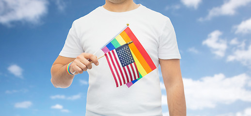 Image showing man with gay pride rainbow flag and wristband