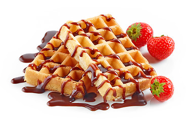 Image showing waffles with strawberries and chocolate sauce