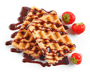 Image showing two waffles decorated with chocolat sauce and strawberries