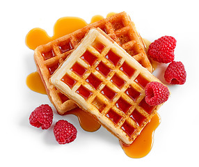 Image showing waffles with syrup and raspberries