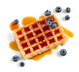 Image showing waffle with caramel syrup and blueberries