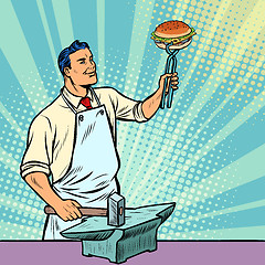 Image showing Cook blacksmith forges a Burger on the anvil