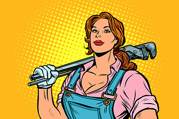 Image showing A strong woman mechanic plumber worker with adjustable wrench