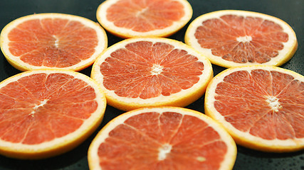 Image showing Slices of grapefruit on table 