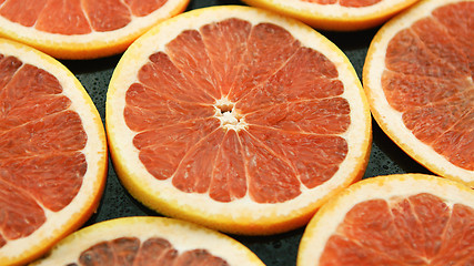 Image showing Composed slices of red grapefruit