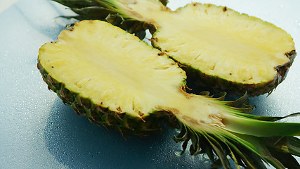 Image showing Bright halves of yellow pineapples