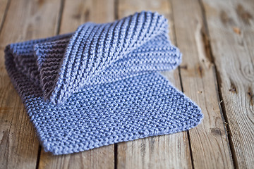 Image showing Blue knitted wooden scarf