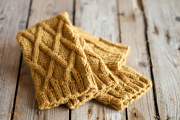 Image showing knitted yellow leg warmers