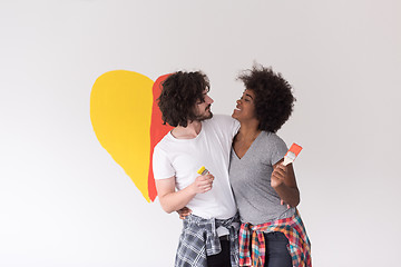 Image showing couple with painted heart on wall