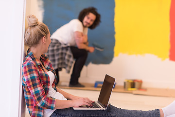 Image showing Happy couple doing home renovations