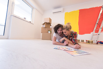 Image showing Happy young couple relaxing after painting